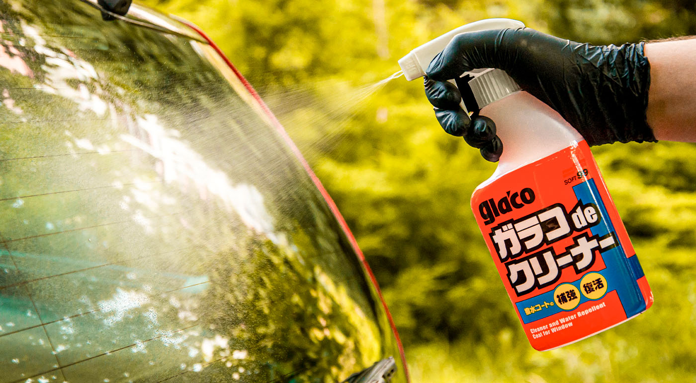Soft99 car care product Glaco de Cleaner being sprayed on a car's window.